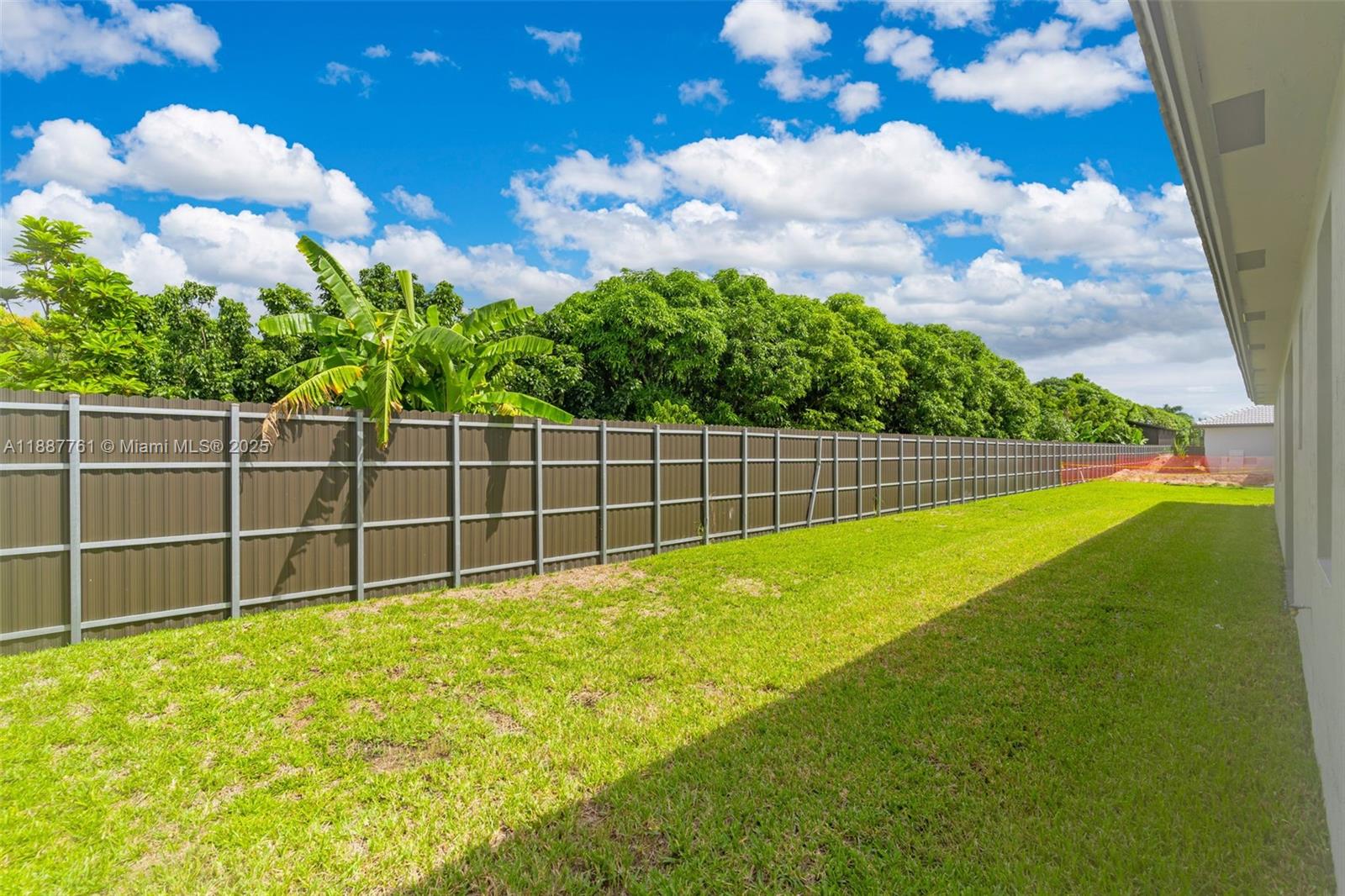 13283 Southwest 188th Terrace Miami, FL 33177 - Photo 13 of 54 a view of a yard with a large tree