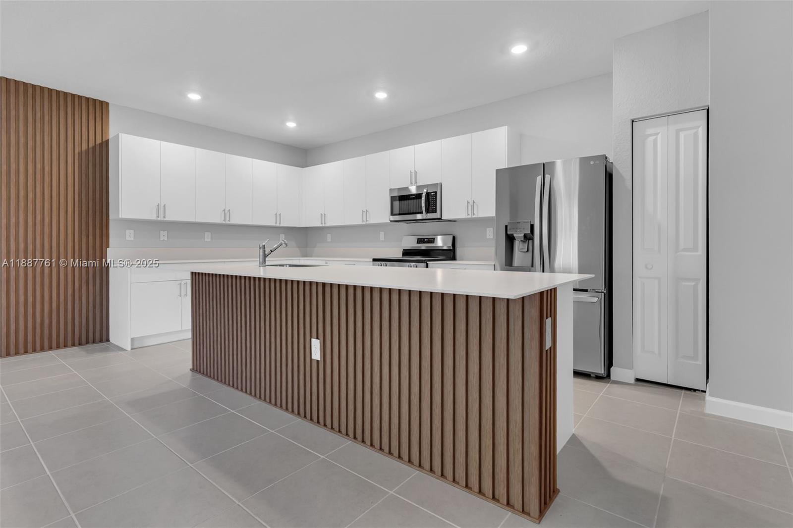 13283 Southwest 188th Terrace Miami, FL 33177 - Photo 21 of 54 a kitchen with stainless steel appliances granite countertop a refrigerator sink and cabinets