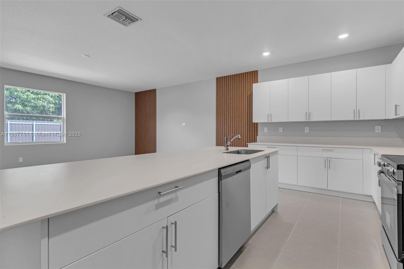 13283 Southwest 188th Terrace Miami, FL 33177 - Photo 22 of 54 a kitchen with a sink cabinets and window