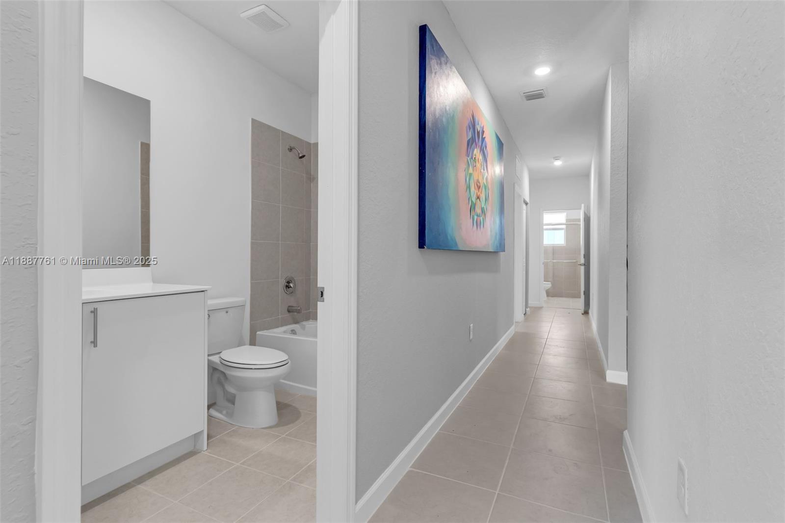 13283 Southwest 188th Terrace Miami, FL 33177 - Photo 30 of 54 a bathroom with a toilet and a mirror