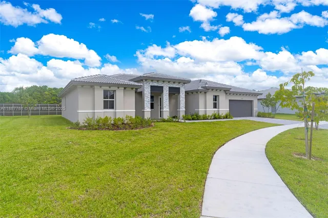 a view of house with a garden