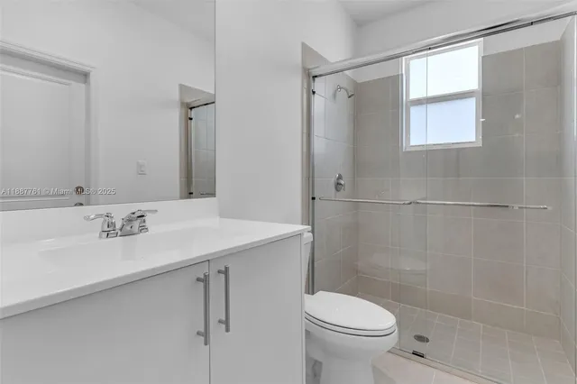 a bathroom with a sink toilet and vanity