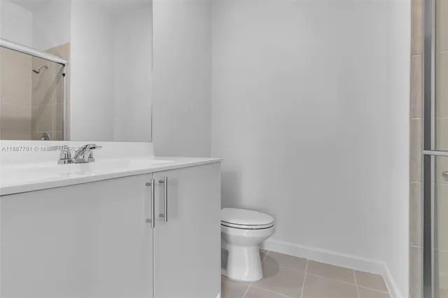 a bathroom with a shower and toilet