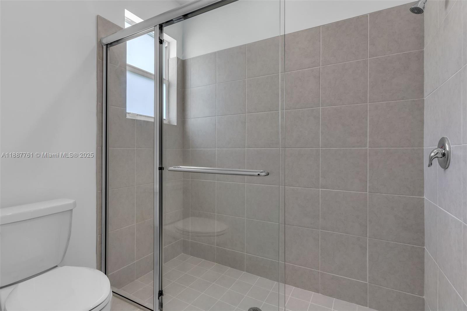 13283 Southwest 188th Terrace Miami, FL 33177 - Photo 47 of 54 a bathroom with a shower and toilet