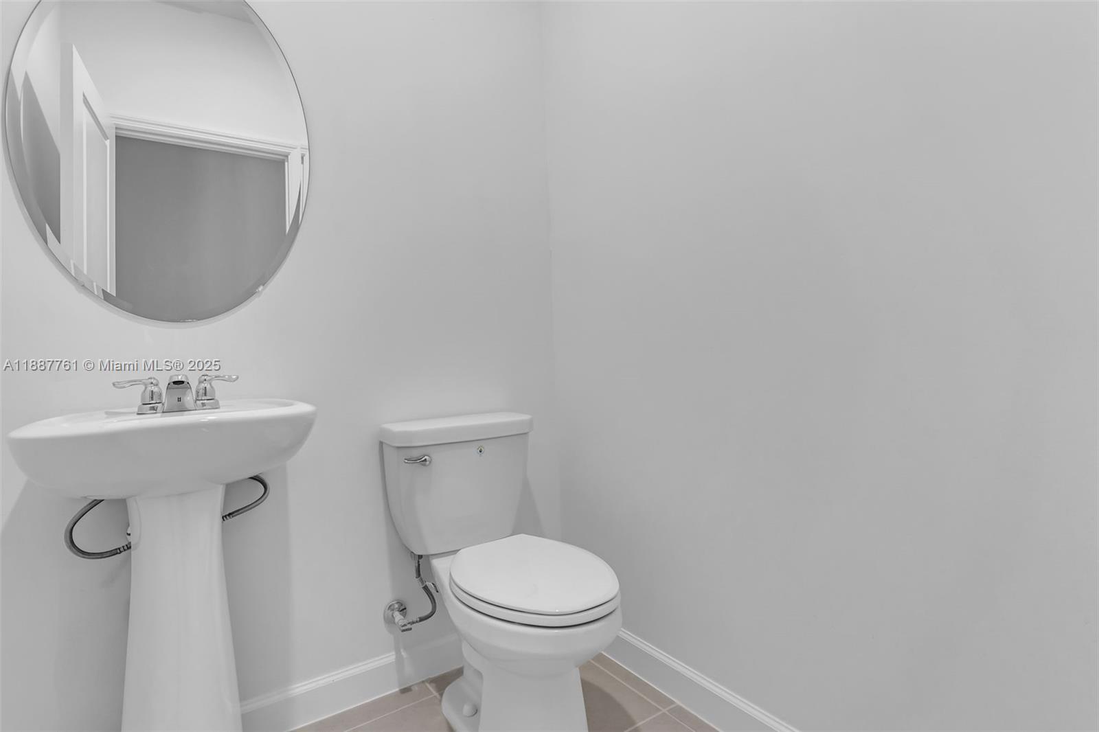 13283 Southwest 188th Terrace Miami, FL 33177 - Photo 52 of 54 a white toilet sitting next to a bathroom sink