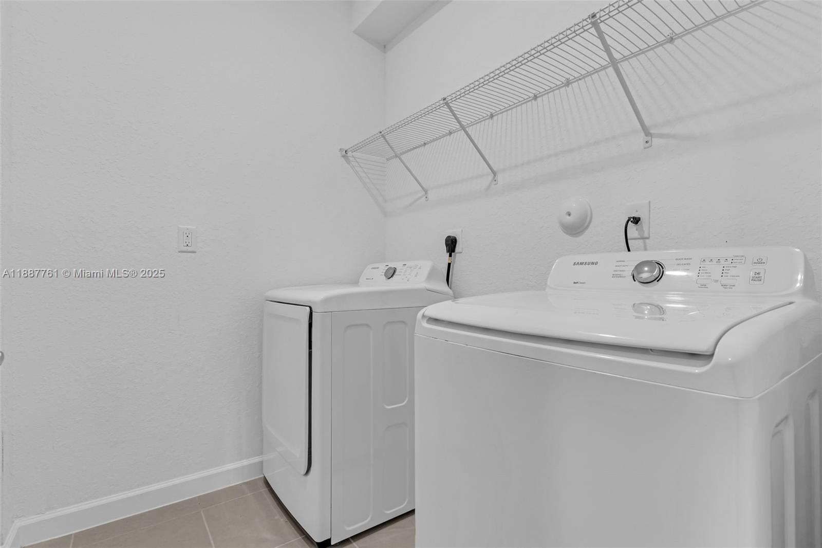 13283 Southwest 188th Terrace Miami, FL 33177 - Photo 53 of 54 a utility room with dryer and washer