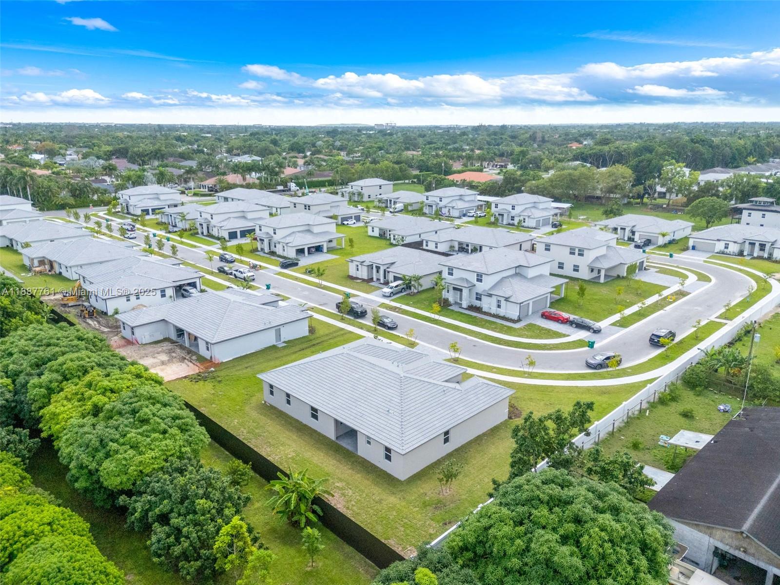 13283 Southwest 188th Terrace Miami, FL 33177 - Photo 9 of 54 an aerial view of residential houses with outdoor space and swimming pool
