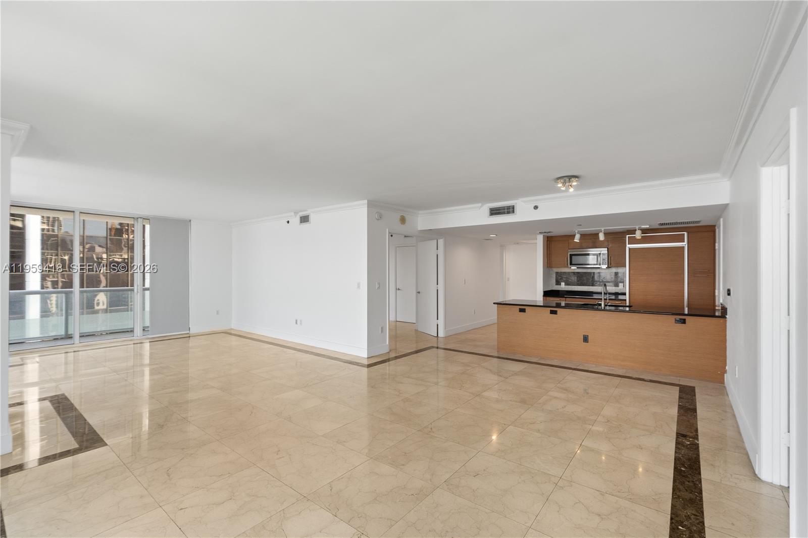 50 Biscayne Boulevard, Unit 3010 Miami, FL 33132 - Photo 13 of 50 a view of a livingroom with wooden floor and a window