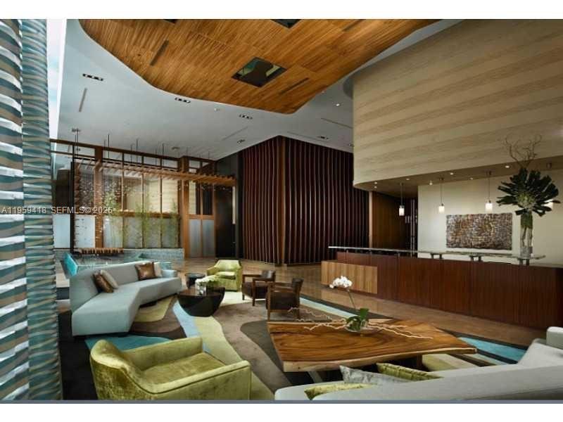 50 Biscayne Boulevard, Unit 3010 Miami, FL 33132 - Photo 37 of 50 a view of a couches and dinning table in patio