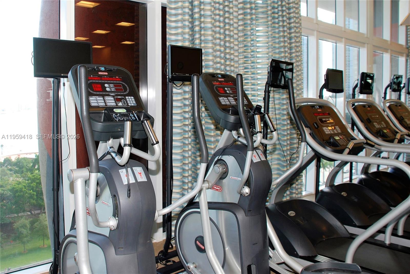 50 Biscayne Boulevard, Unit 3010 Miami, FL 33132 - Photo 43 of 50 a view of a room with gym equipment