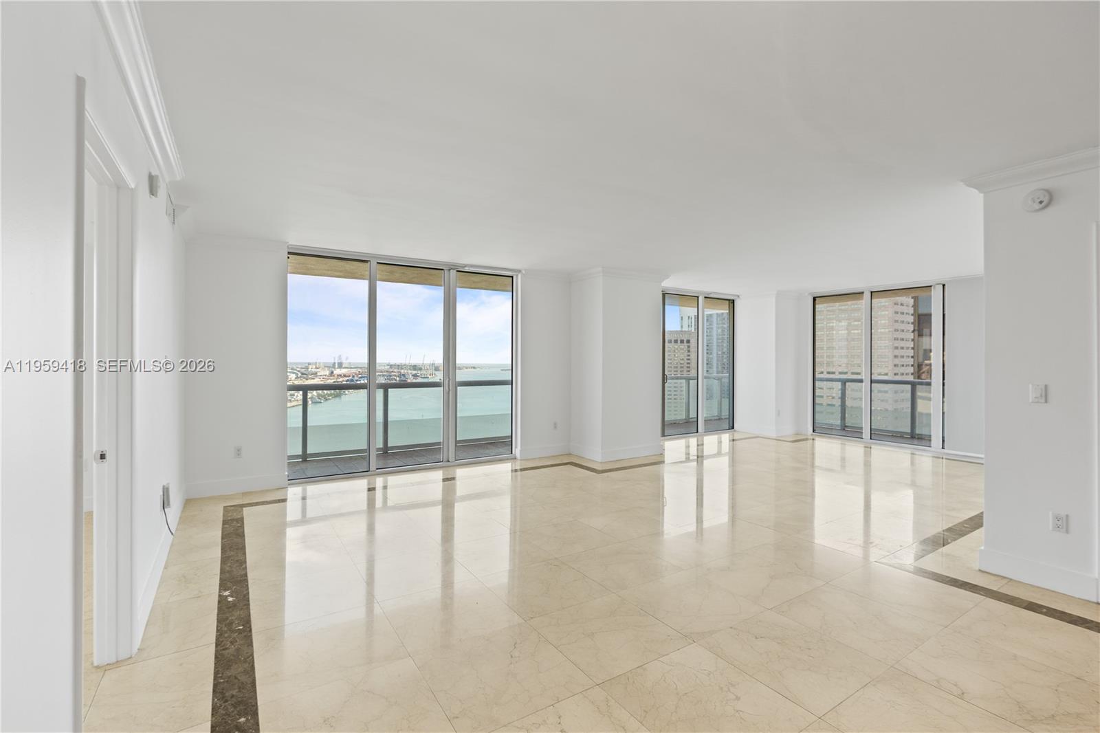 50 Biscayne Boulevard, Unit 3010 Miami, FL 33132 - Photo 10 of 50 a view of an empty room with glass door