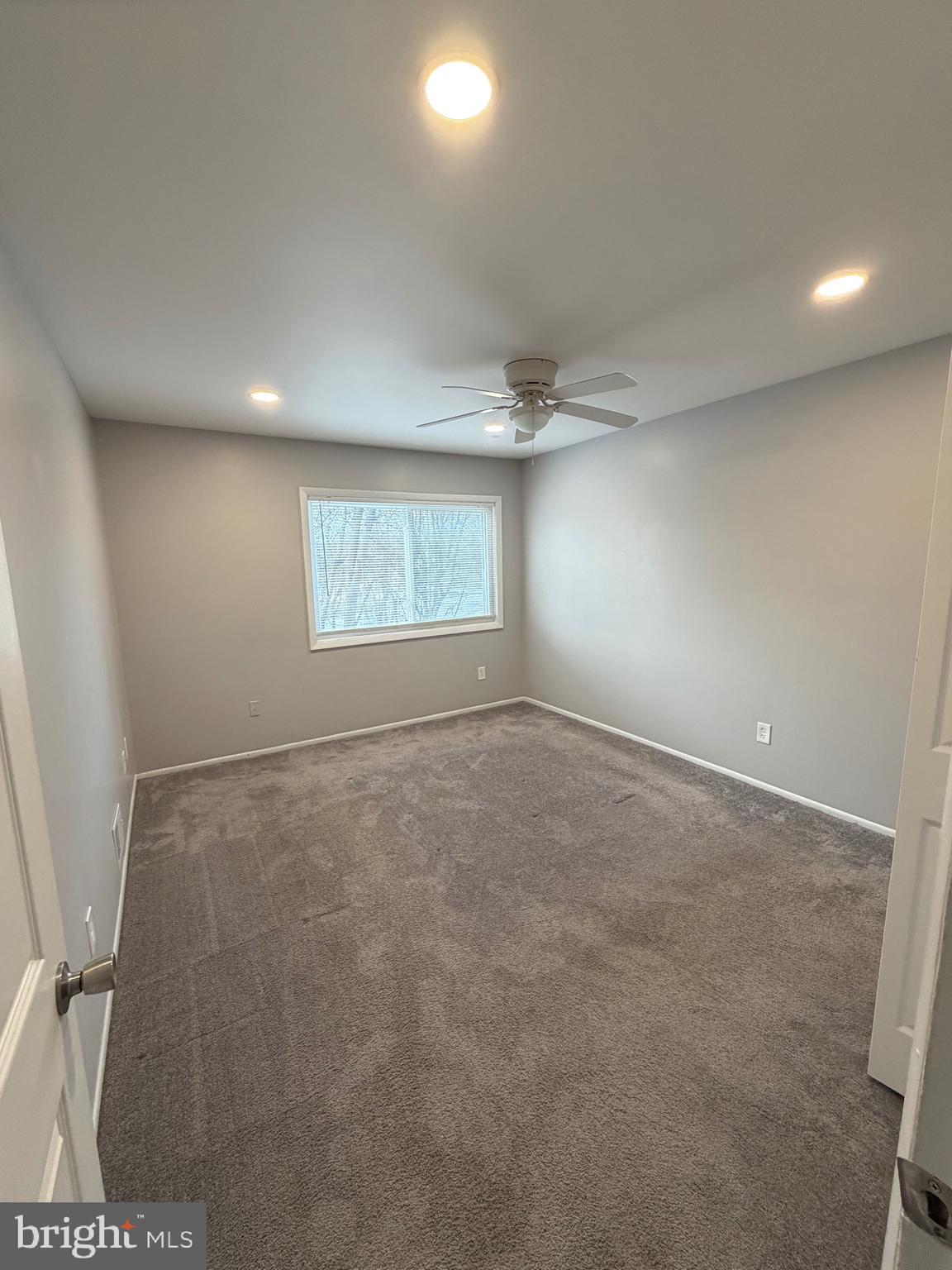 1914 Cavalier Circle, Unit A Crofton, MD 21114 - Photo 9 of 10 an empty room with a empty space and windows