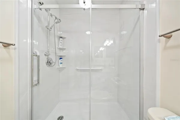 a spacious bathroom with a granite countertop sink a mirror and vanity