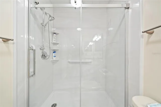 a spacious bathroom with a granite countertop sink a mirror and vanity