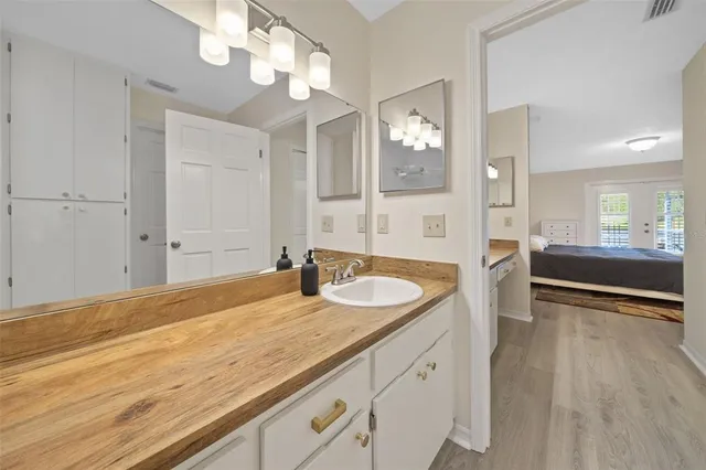 a bedroom with two beds and a large window