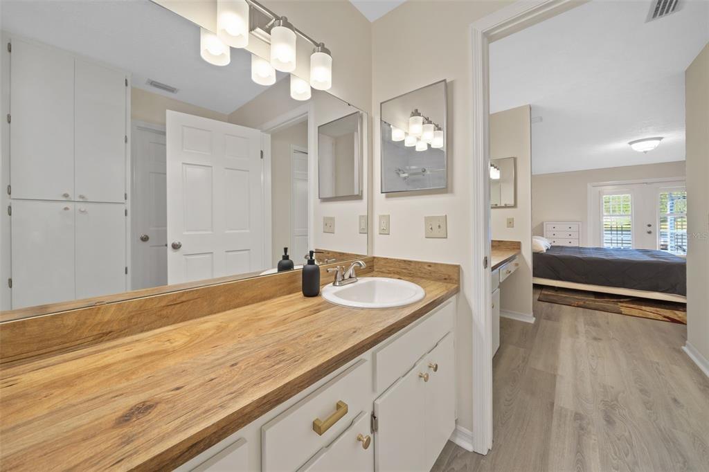 653 Timber Pond Drive Brandon, FL 33510 - Photo 13 of 56 a spacious bathroom with a granite countertop sink a mirror and vanity