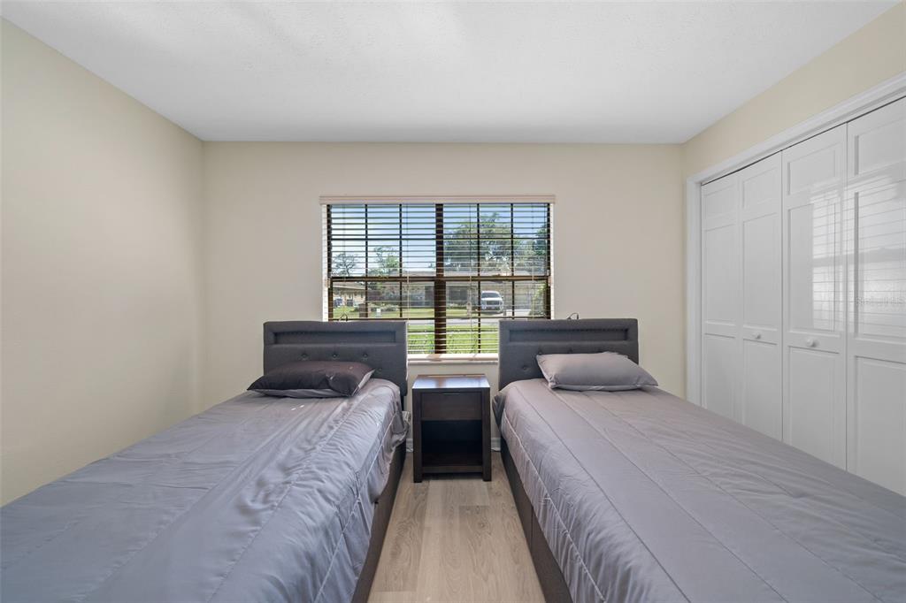 653 Timber Pond Drive Brandon, FL 33510 - Photo 15 of 56 a bedroom with two beds and a window