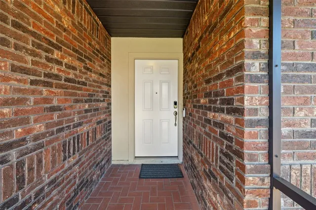 a view of a brick house with a door