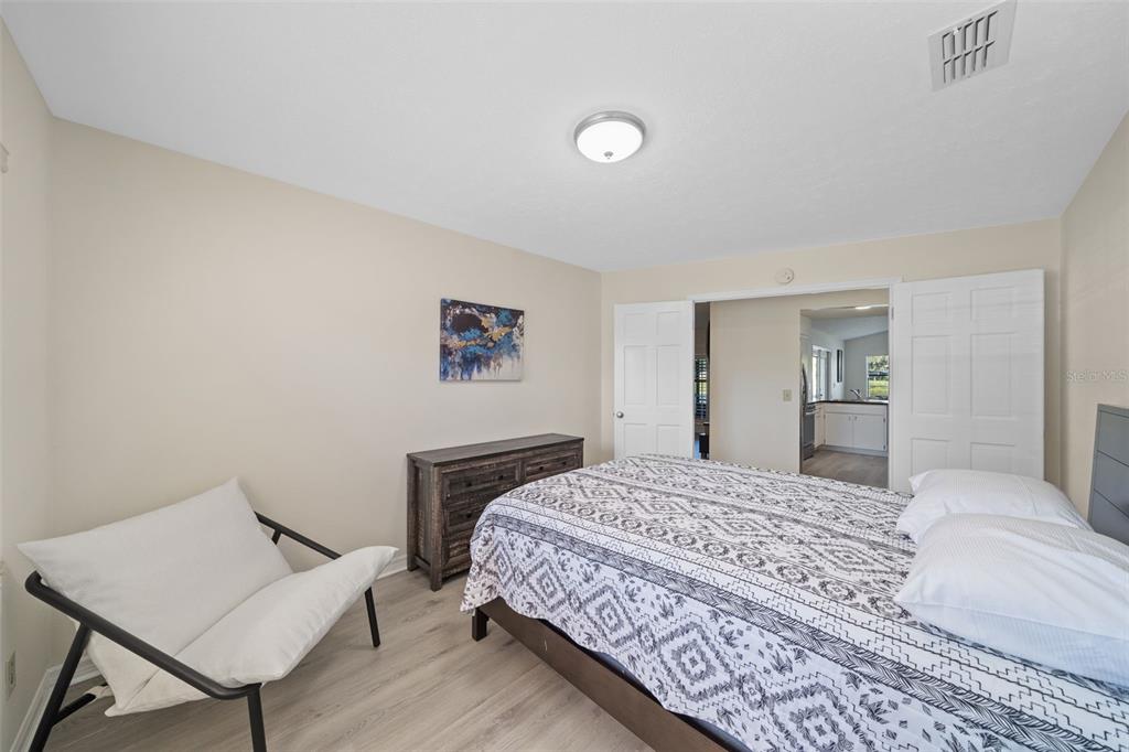 653 Timber Pond Drive Brandon, FL 33510 - Photo 26 of 56 a bedroom with a bed and a table in it