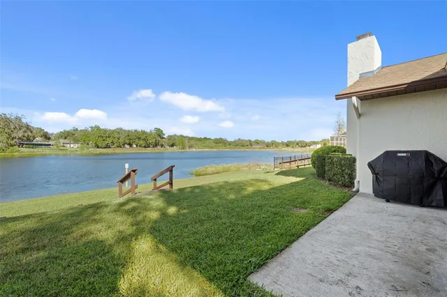a view of a house with backyard porch and sitting area