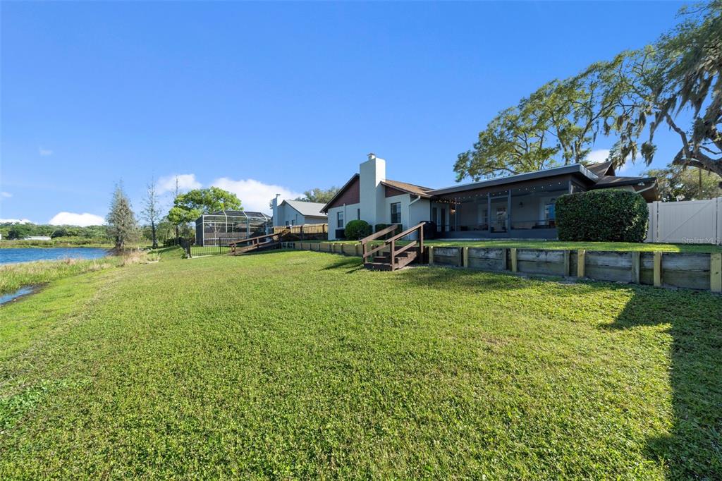 653 Timber Pond Drive Brandon, FL 33510 - Photo 43 of 56 a view of a house with backyard porch and sitting area