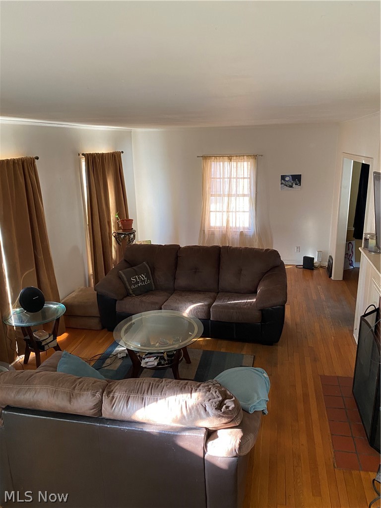 Living room featuring with hardwood flooring- view from stairs