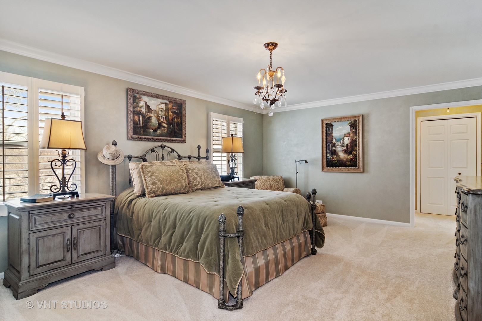 129 Knockderry Lane Inverness, IL 60067 - Photo 14 of 34 a spacious bedroom with a bed and dresser with mirror