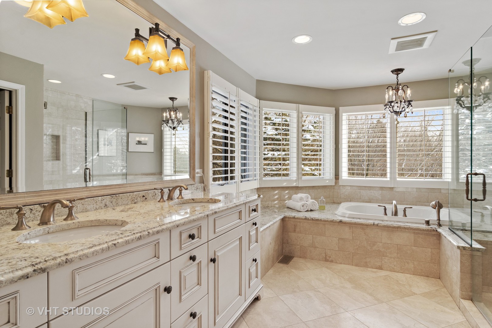 129 Knockderry Lane Inverness, IL 60067 - Photo 15 of 34 a spacious bathroom with a granite countertop sink and a large mirror