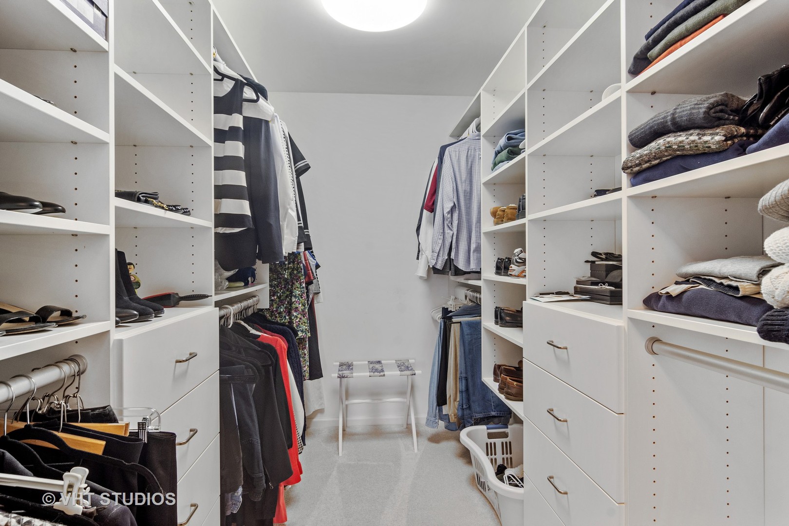 129 Knockderry Lane Inverness, IL 60067 - Photo 17 of 34 a view of walk in closet with clothes and shoes
