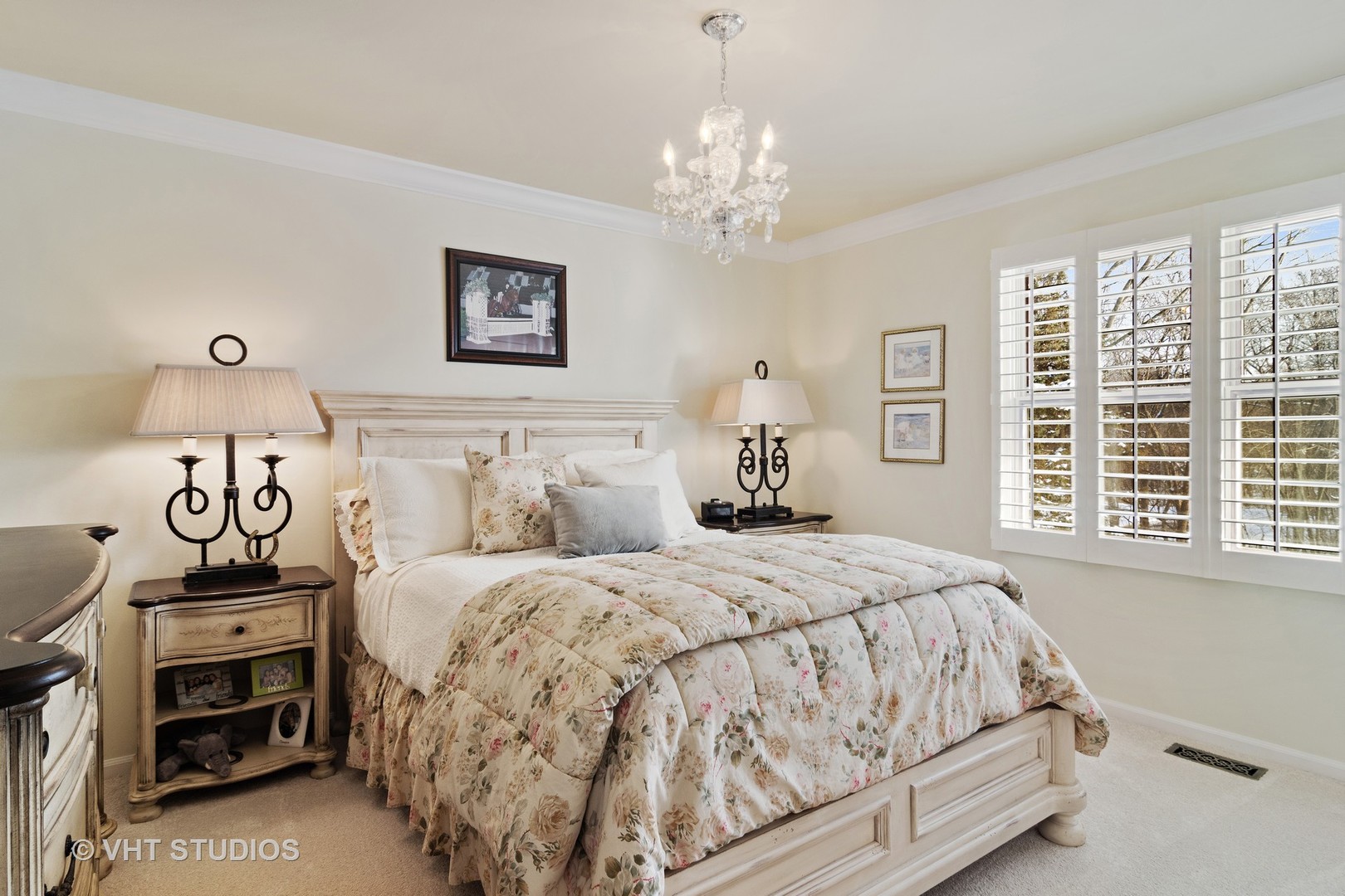 129 Knockderry Lane Inverness, IL 60067 - Photo 18 of 34 a bedroom with a bed and a chandelier