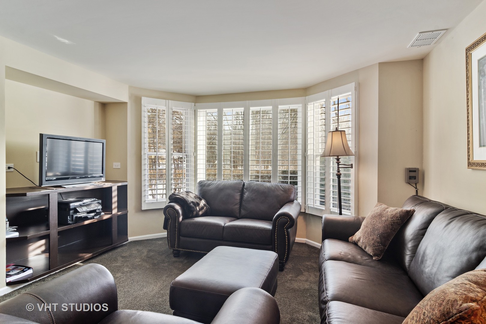 129 Knockderry Lane Inverness, IL 60067 - Photo 25 of 34 a living room with furniture a flat screen tv and a large window