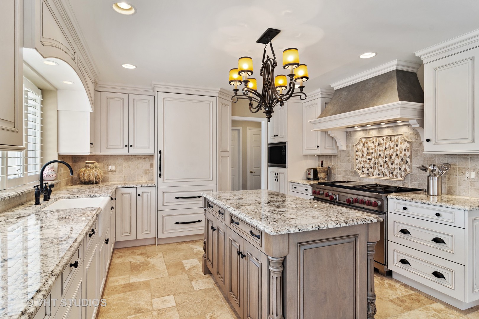 129 Knockderry Lane Inverness, IL 60067 - Photo 6 of 34 a kitchen with stainless steel appliances granite countertop a sink and cabinets