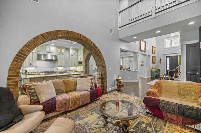a living room with furniture fireplace and flat screen tv