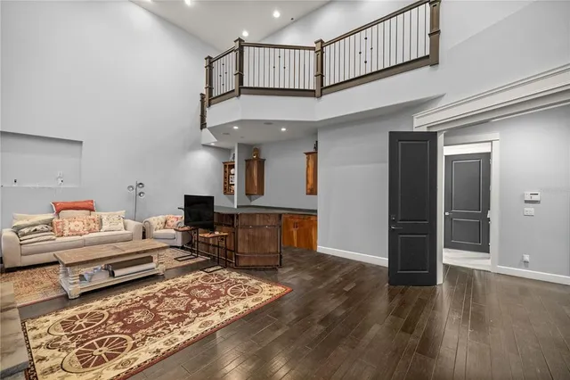 a view of entryway and dining room with wooden floor