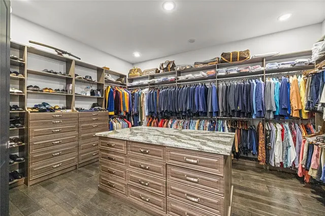a bathroom with a tub shower and sink