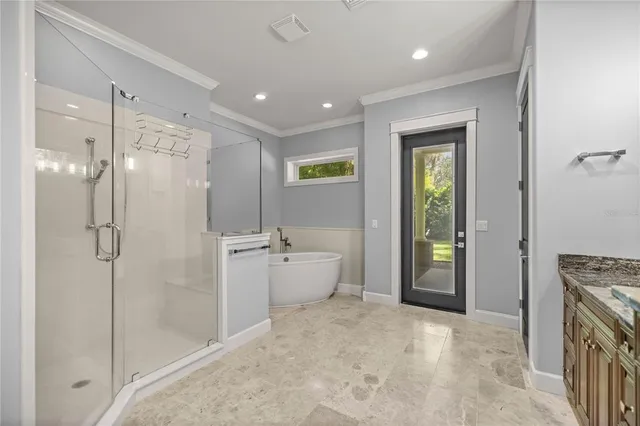 a spacious bathroom with a granite countertop sink mirror and shower