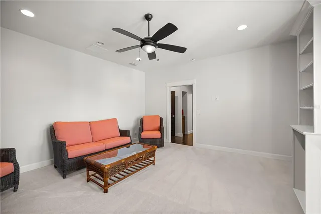 a view of walk in closet with clothes