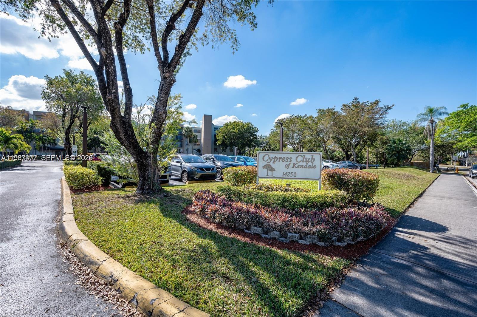 14250 Southwest 62nd Street, Unit 517 Miami, FL 33183 - Photo 1 of 47 a view of a garden with a fountain