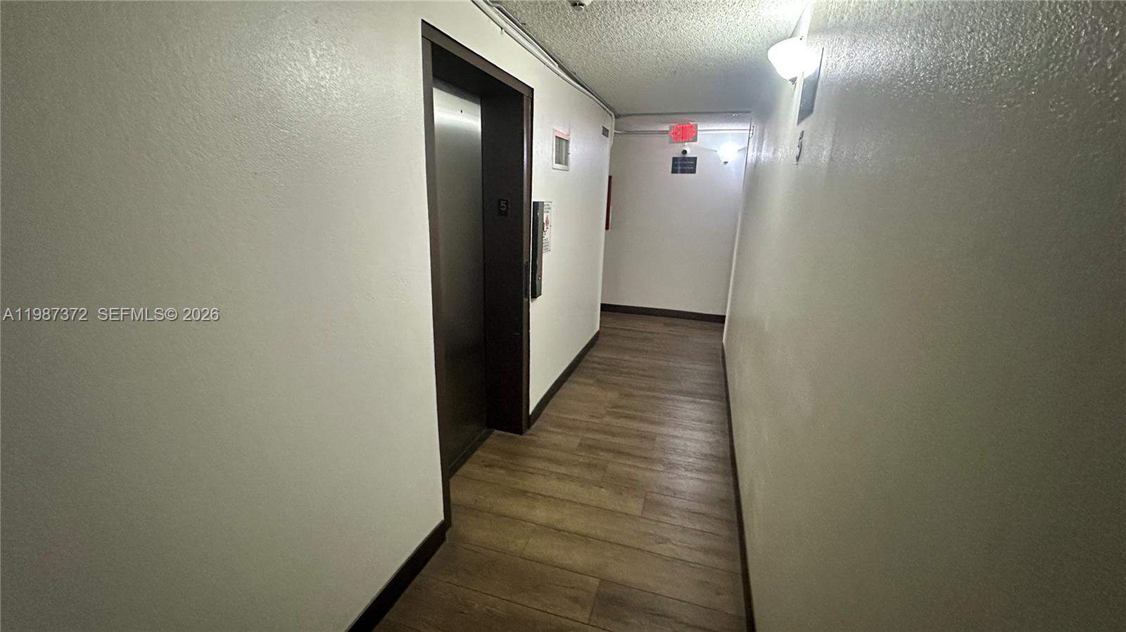 14250 Southwest 62nd Street, Unit 517 Miami, FL 33183 - Photo 14 of 47 a view of a hallway with wooden floor