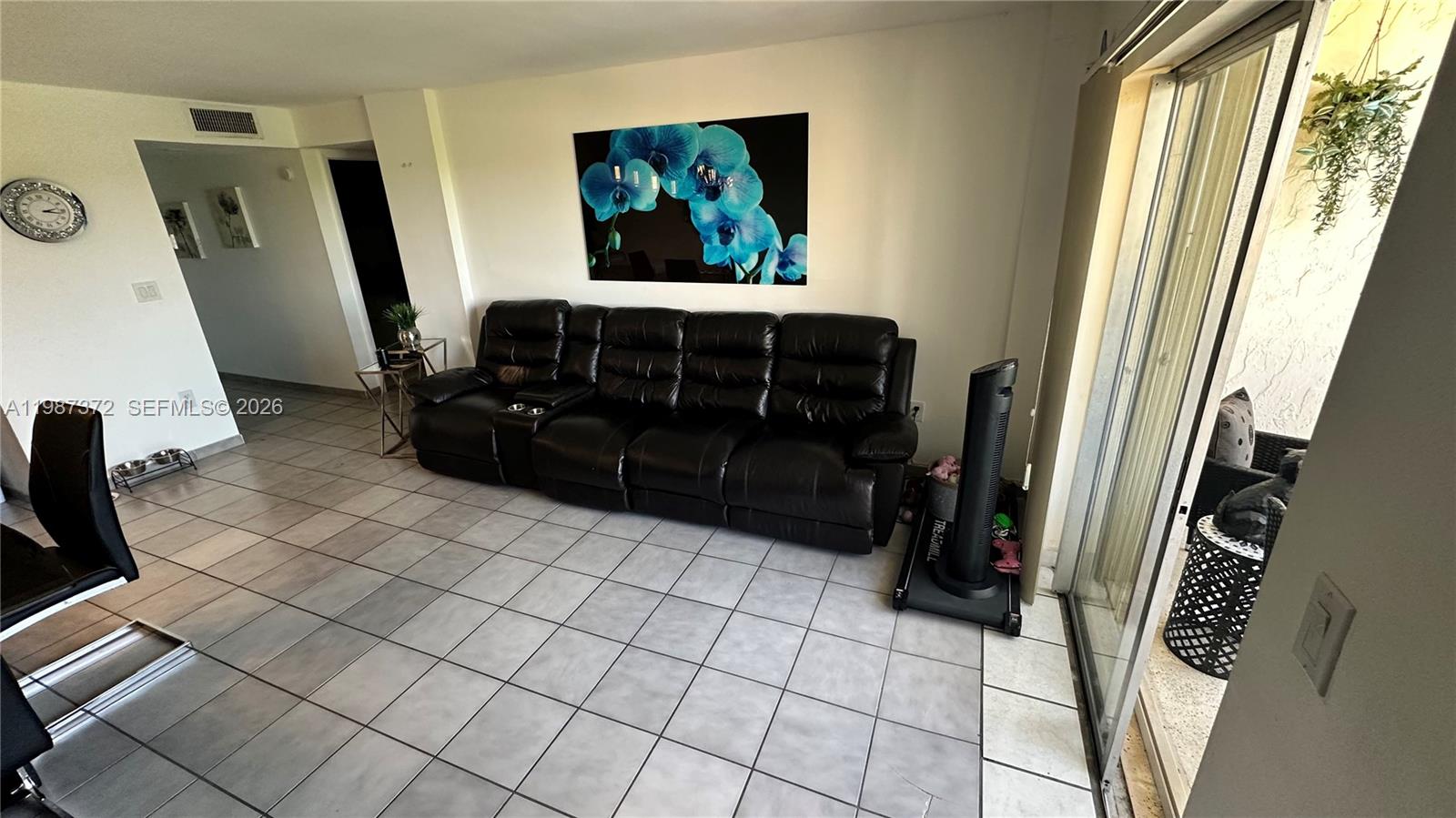 14250 Southwest 62nd Street, Unit 517 Miami, FL 33183 - Photo 21 of 47 a room with furniture and a flat screen tv