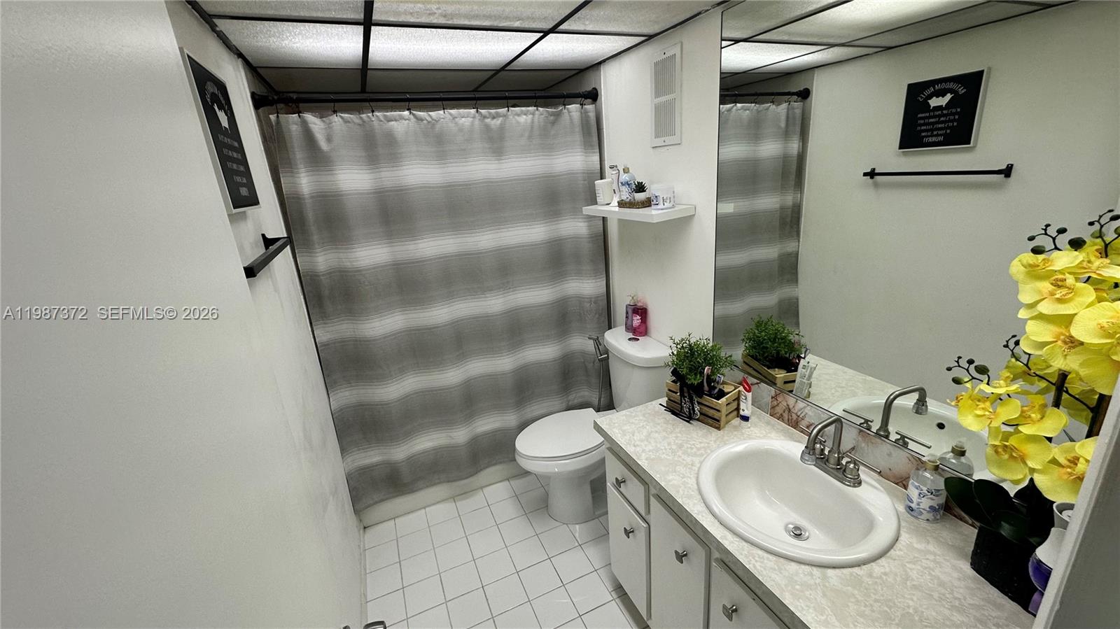 14250 Southwest 62nd Street, Unit 517 Miami, FL 33183 - Photo 23 of 47 a bathroom with a sink toilet and shower