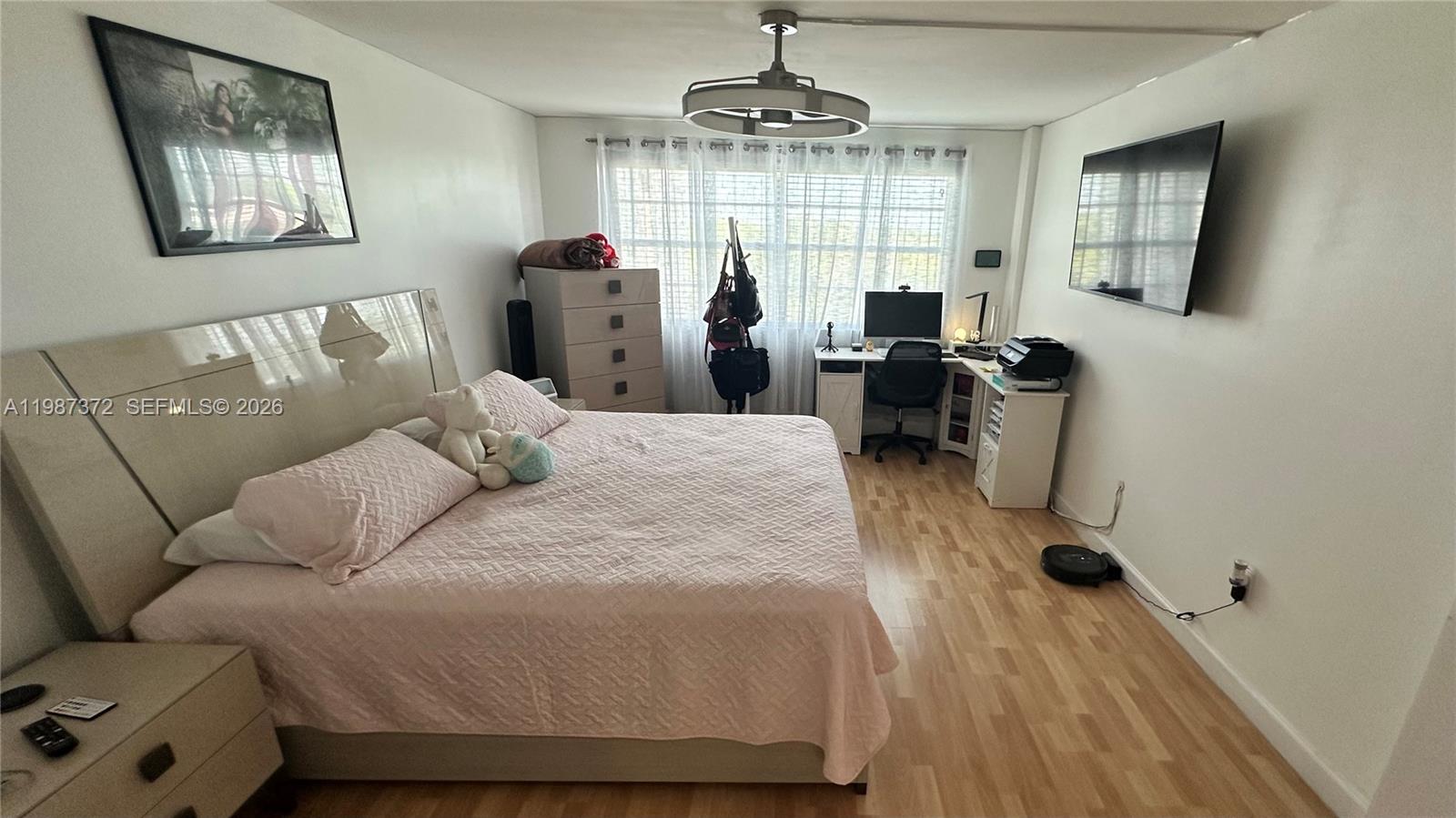 14250 Southwest 62nd Street, Unit 517 Miami, FL 33183 - Photo 26 of 47 a living room with furniture and a chandelier