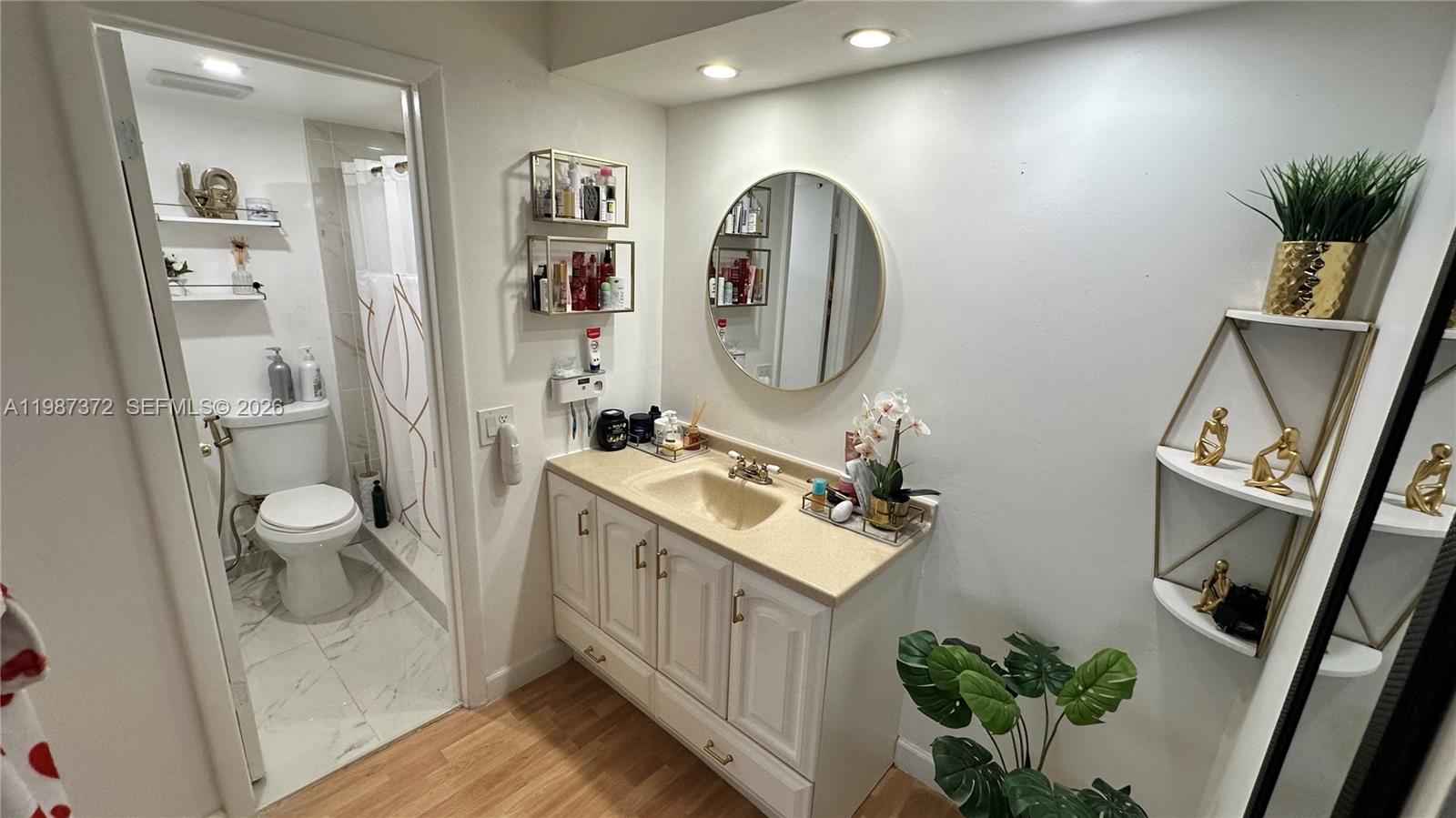 14250 Southwest 62nd Street, Unit 517 Miami, FL 33183 - Photo 27 of 47 a spacious bathroom with a double vanity sink and a mirror