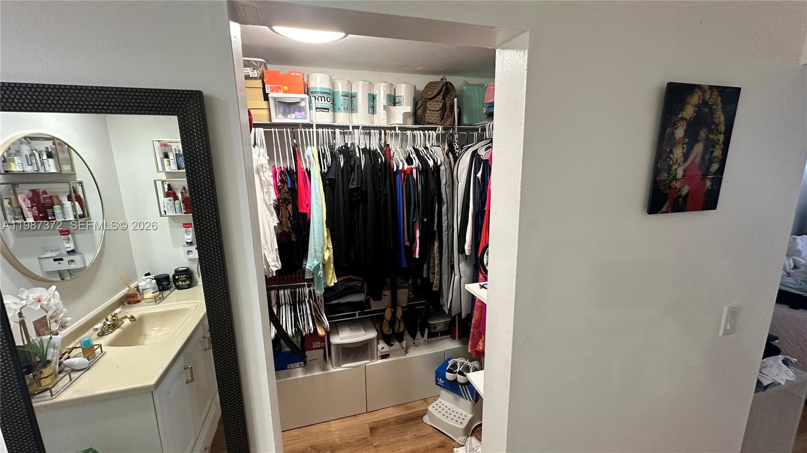 14250 Southwest 62nd Street, Unit 517 Miami, FL 33183 - Photo 29 of 47 a view of walk in closet with clothes and shoes