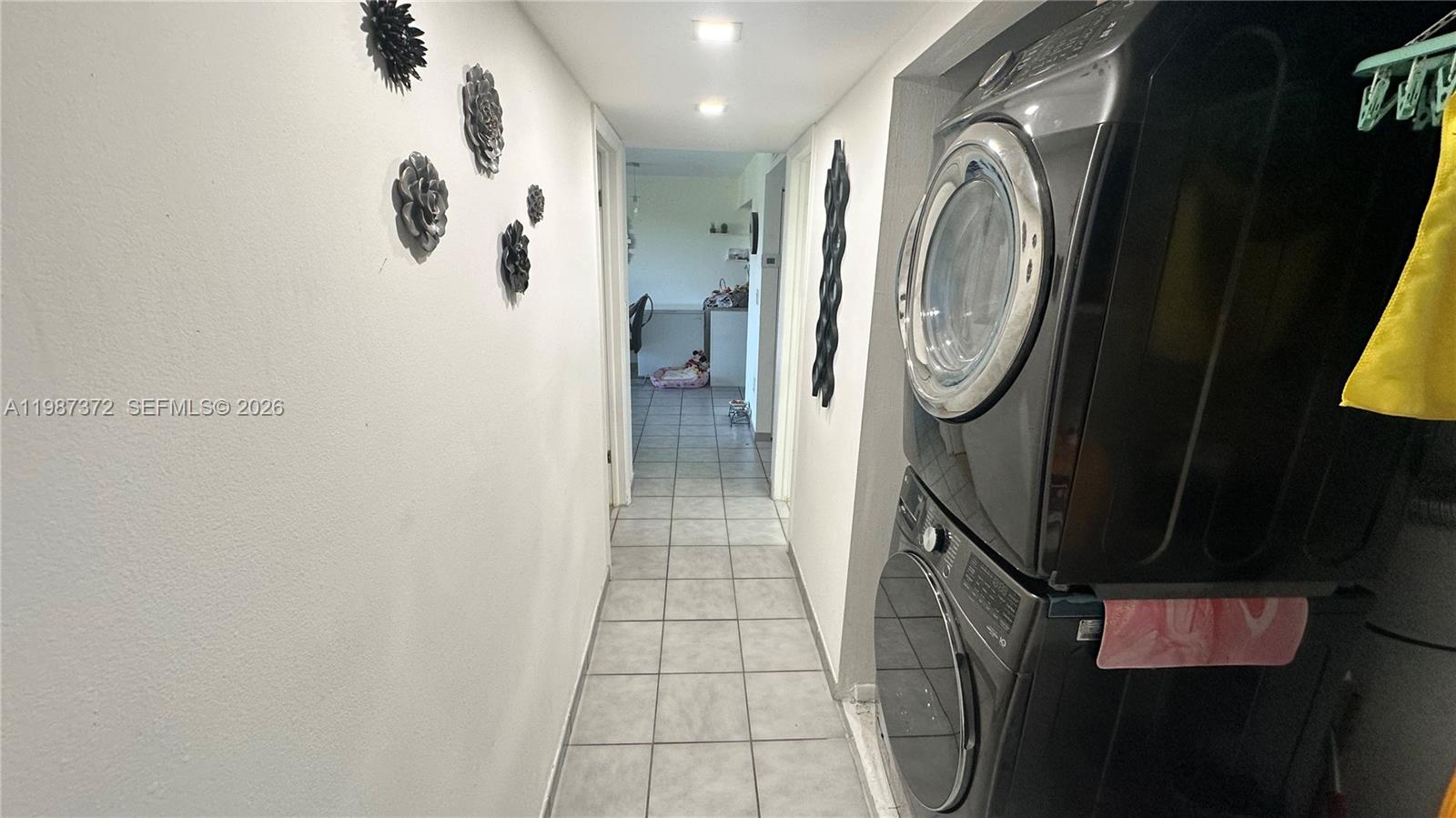14250 Southwest 62nd Street, Unit 517 Miami, FL 33183 - Photo 30 of 47 a bathroom with a sink a toilet and a shower