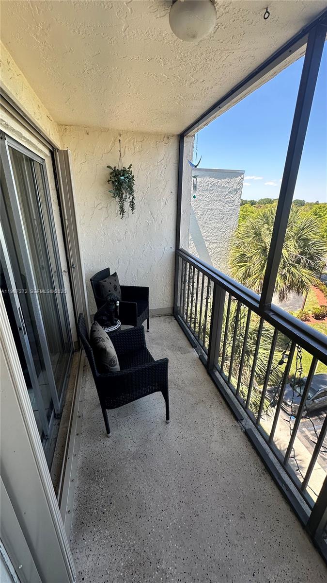 14250 Southwest 62nd Street, Unit 517 Miami, FL 33183 - Photo 32 of 47 a living room with furniture and a window
