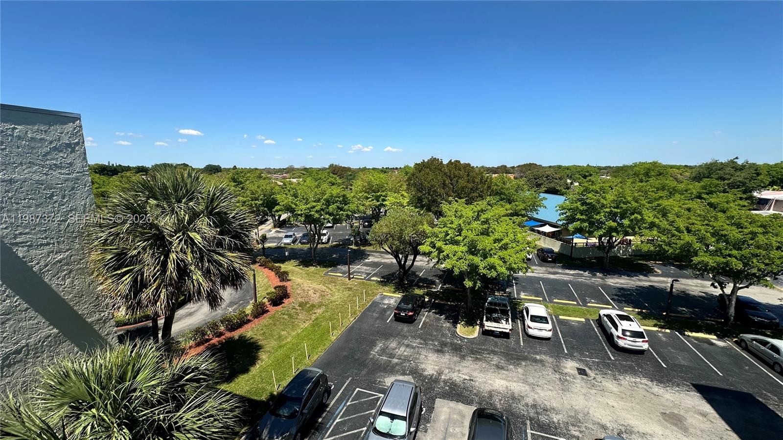 14250 Southwest 62nd Street, Unit 517 Miami, FL 33183 - Photo 36 of 47 a view of a swimming pool with a patio