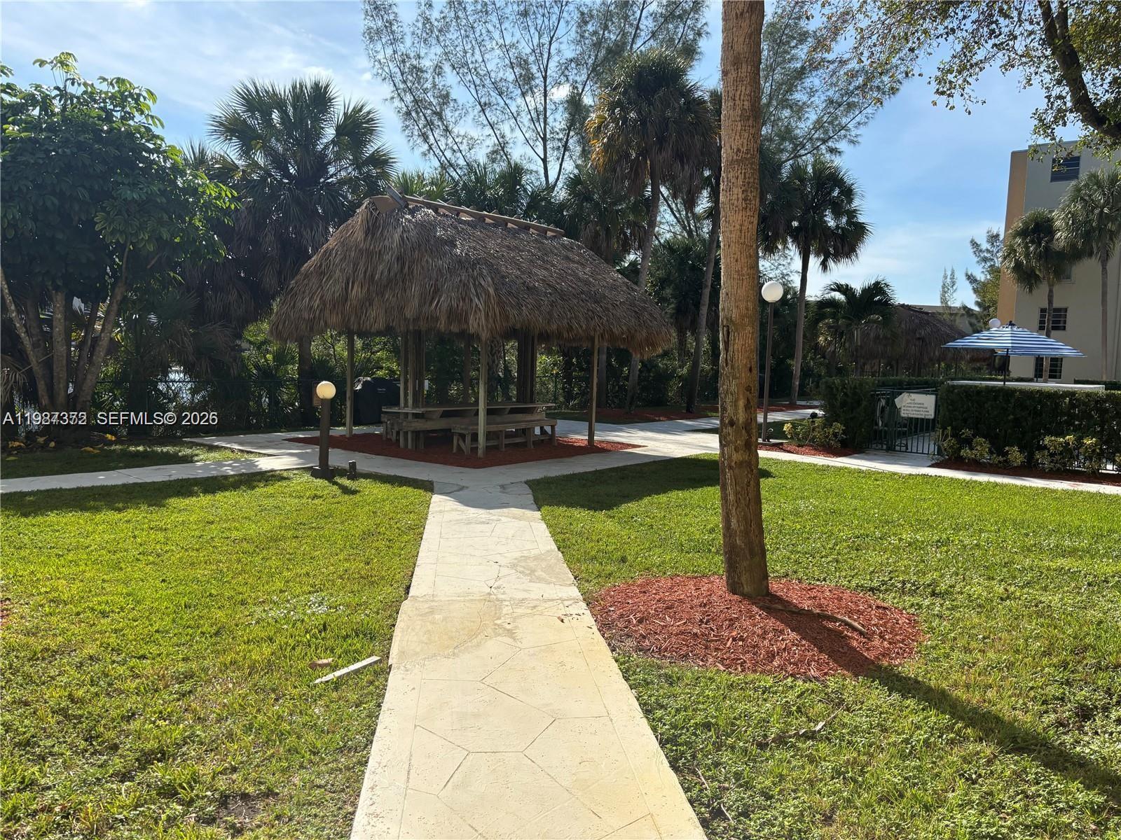14250 Southwest 62nd Street, Unit 517 Miami, FL 33183 - Photo 42 of 47 a swimming pool view with a seating space