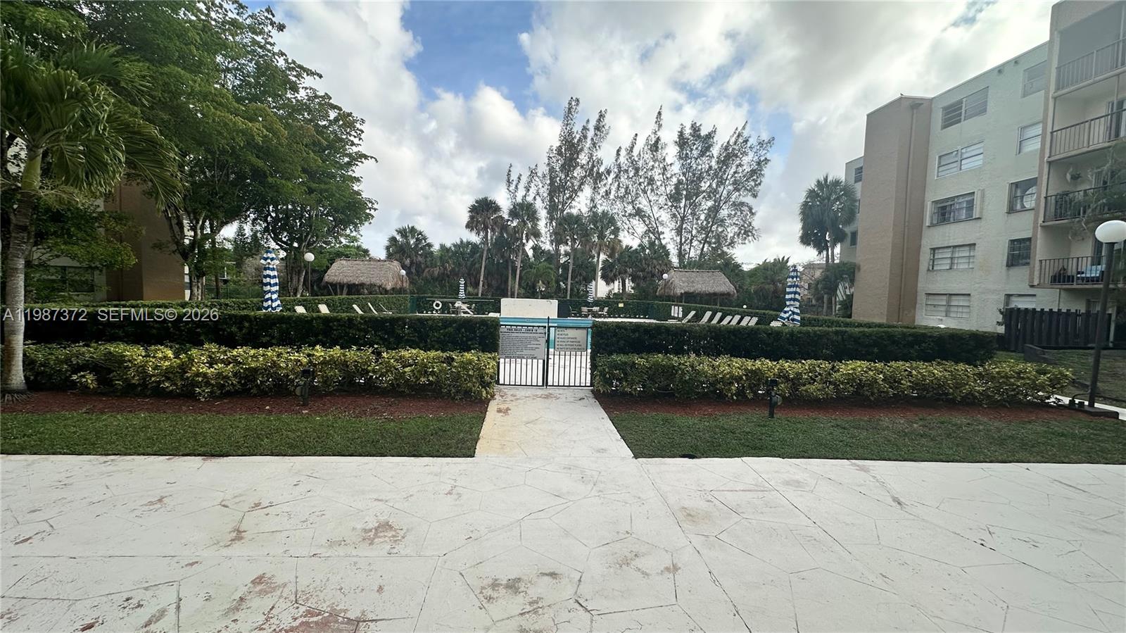 14250 Southwest 62nd Street, Unit 517 Miami, FL 33183 - Photo 44 of 47 a view of a park with large trees