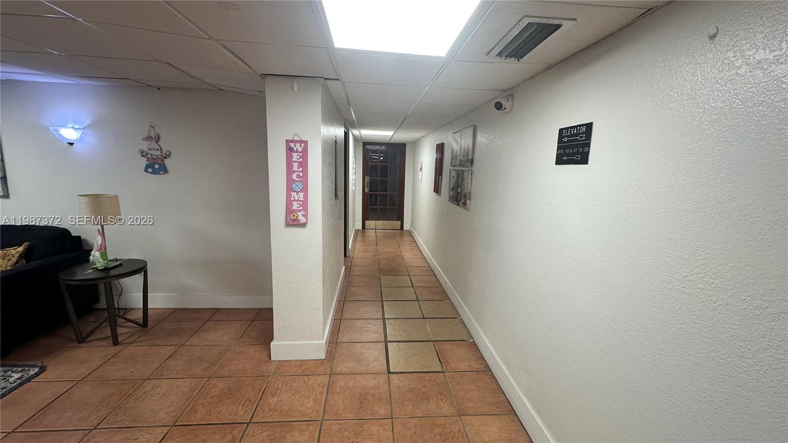 14250 Southwest 62nd Street, Unit 517 Miami, FL 33183 - Photo 9 of 47 a hallway with a view of kitchen